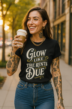 Load image into Gallery viewer, Glow Like the Rent’s Due Tee
